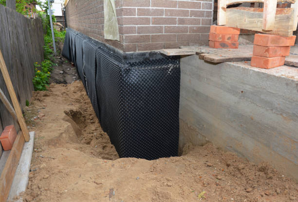 Happy homeowners after waterproofing job in Grant